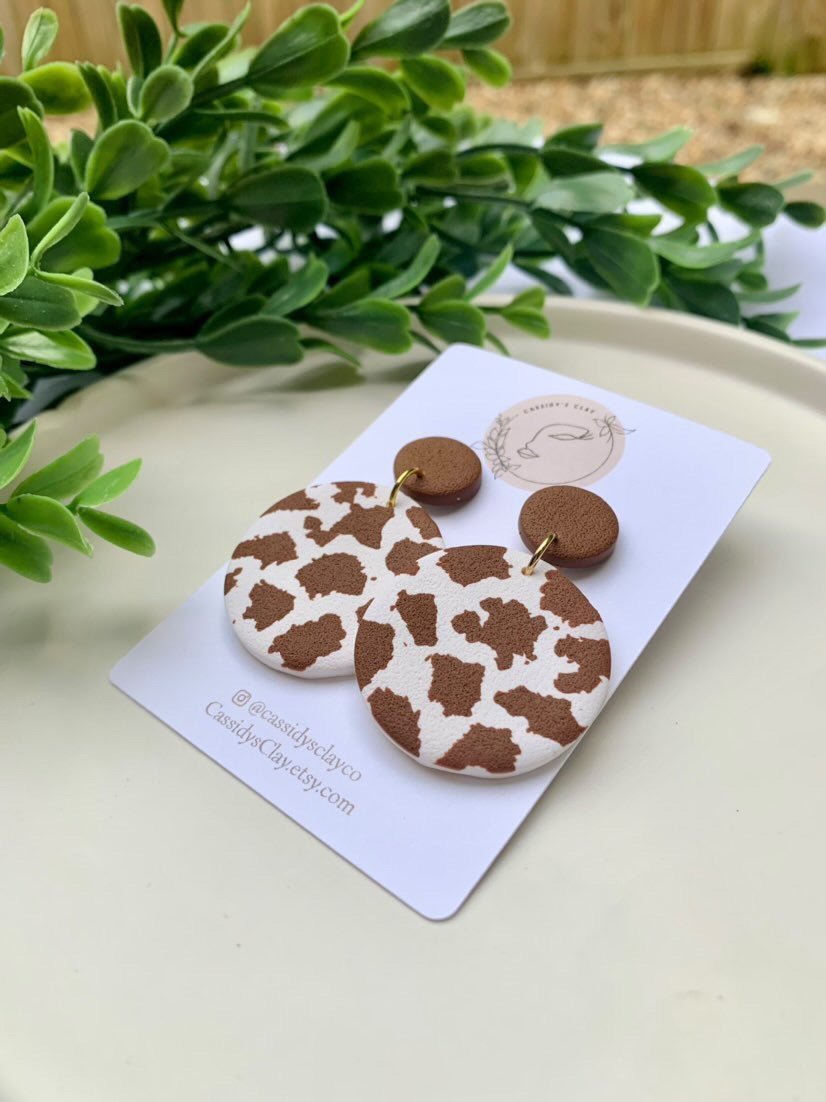 Who's That Heifer - Brown and White Round Clay Earrings