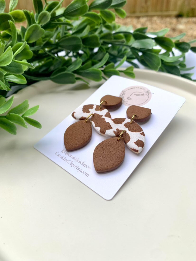 Who's That Heifer - Brown & White 3 Tier Clay Earrings